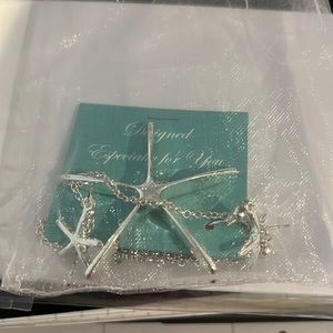 Matching Star necklace and earrings. NWT. Still in gift bag